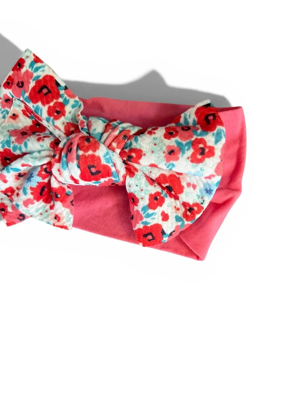 pink Ditsy Daisy knotted baby headband with a floral-patterned bow